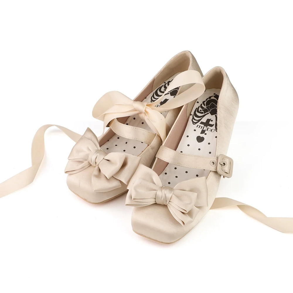 Off-white satin Lolita shoes with large bows, buckles and matching ribbons
