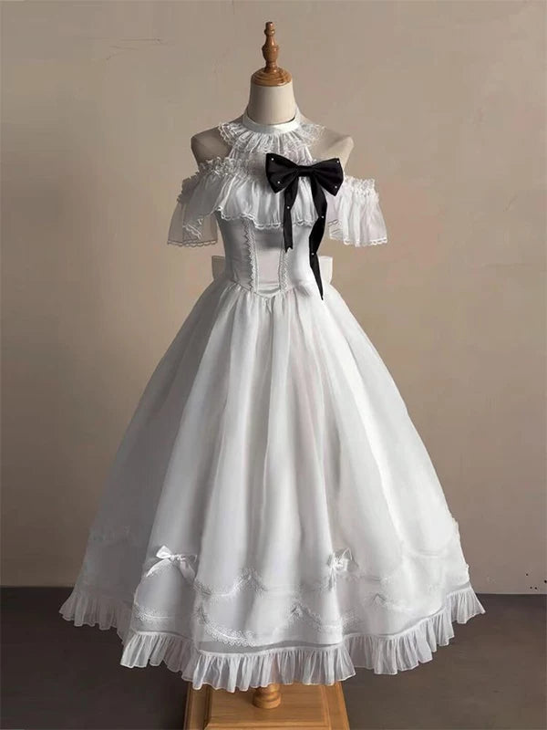 White lace off-shoulder OP dress with a black bow, displayed on a mannequin.