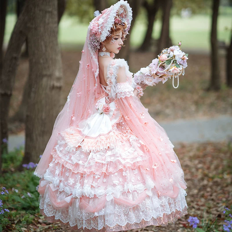 Close-up of the tiered skirt with sheer chiffon overlay, ruffled edges, and floral appliqués