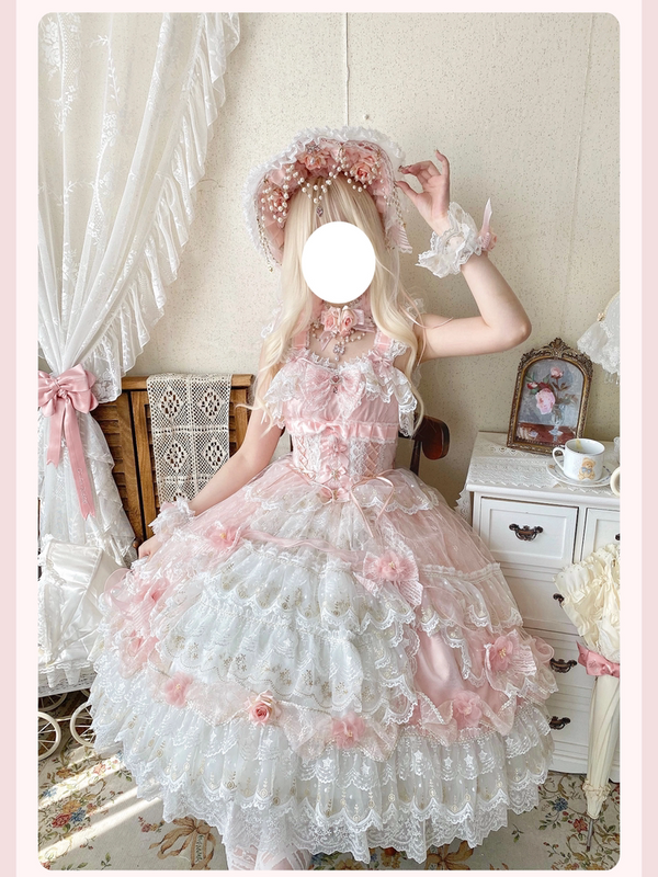 Blush pink Sweet Lolita tea party gown with tiered ruffled skirt and floral appliqués, worn by model