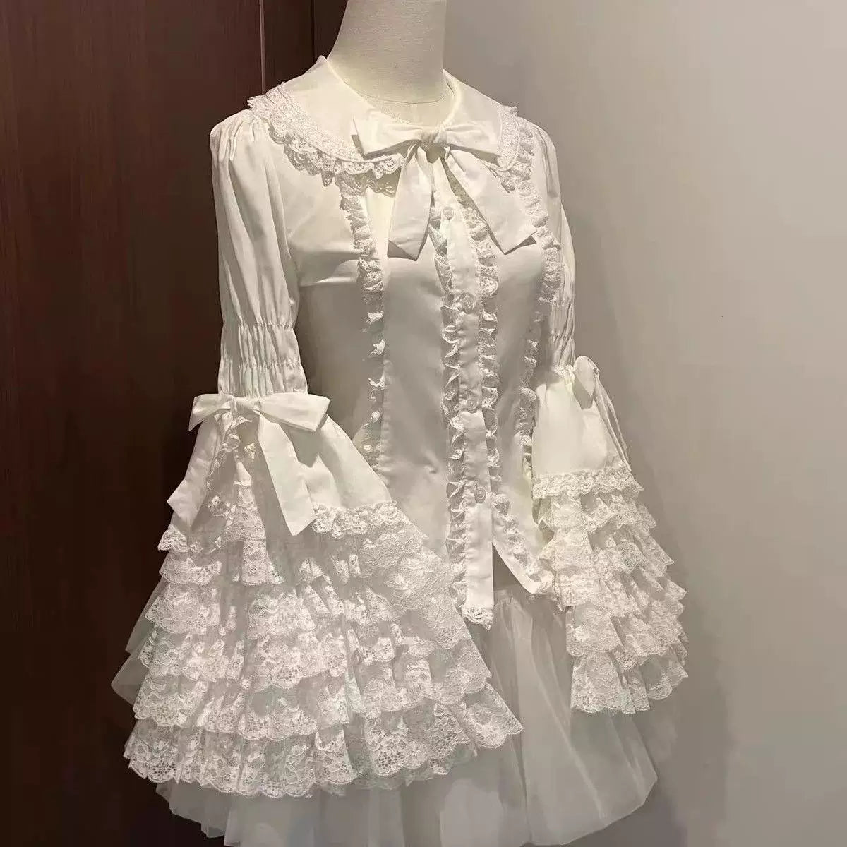 Apricot sweet lolita lace blouse with bell sleeves, scalloped lace trim, and included neck bow