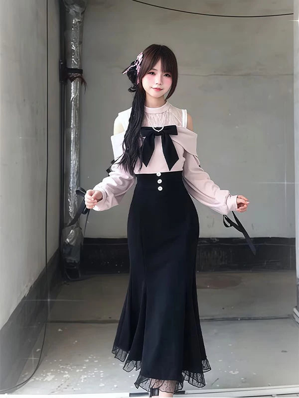 Black-and-pale-pink off-shoulder dress with heart-ring bow and lace hem on a model