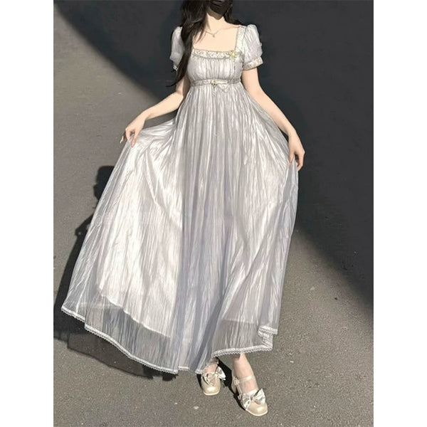 Purple empire-style Lolita dress with short puff sleeves shown on a model