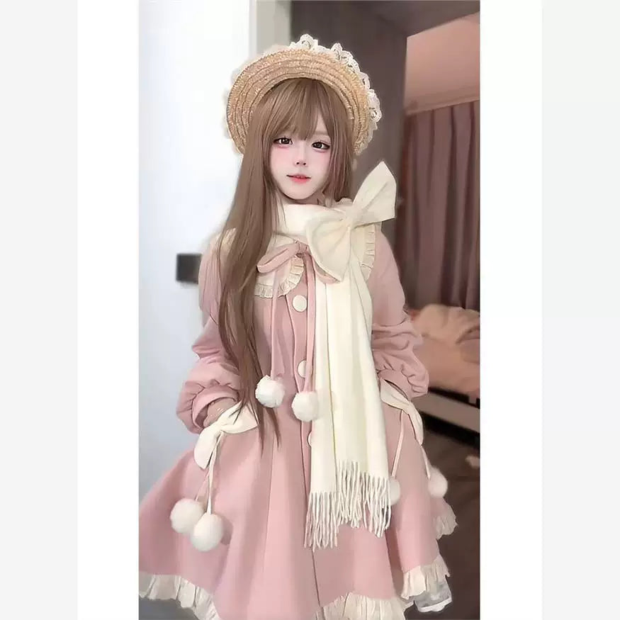 Model wearing a pink cotton-padded coat dress with an oversized milky-white bow scarf.