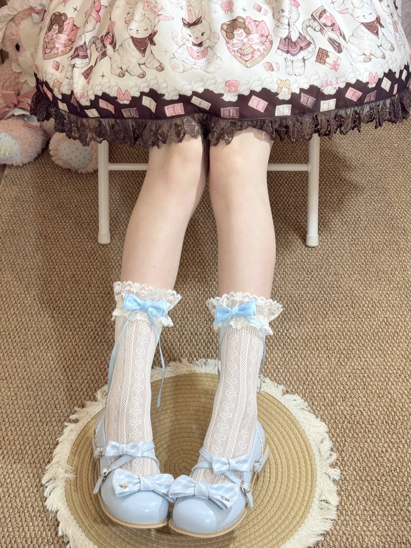 Lace mid-calf socks with pastel blue and pink ribbon bows styled with Lolita shoes.