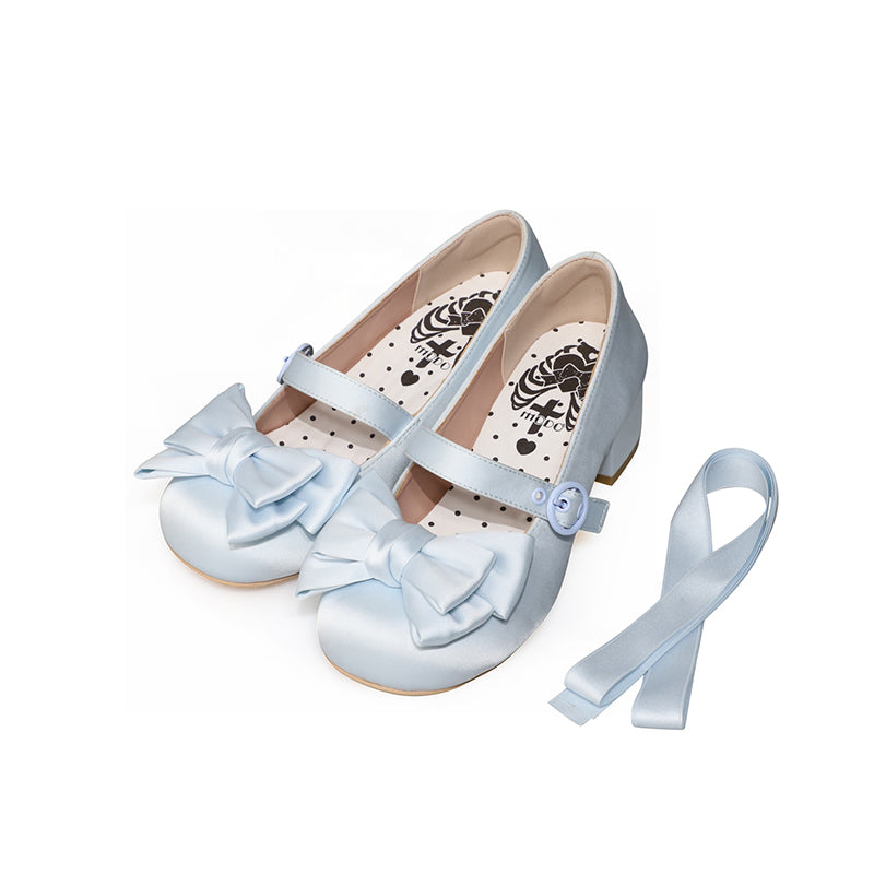 Pair of light-blue satin Lolita shoes with large bows, buckle straps and matching ribbon.