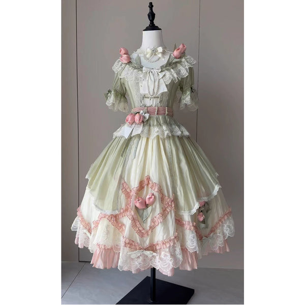 Green-pink short-sleeve Lolita dress with lace layers and floral accents on a mannequin.