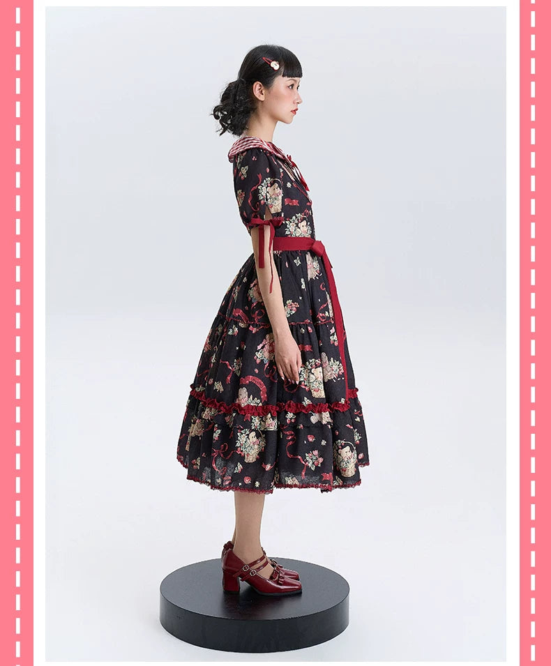 Black and ivory printed OP dresses with red trim and full skirts