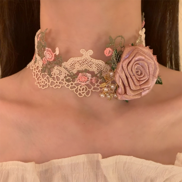 Pink rose lace choker necklace worn at the neckline