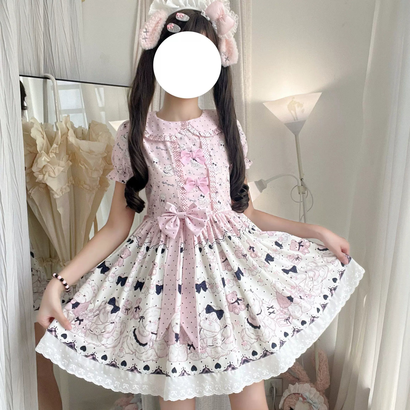 Black sweet Lolita OP dress with bow, belt, and polka dot hair clip