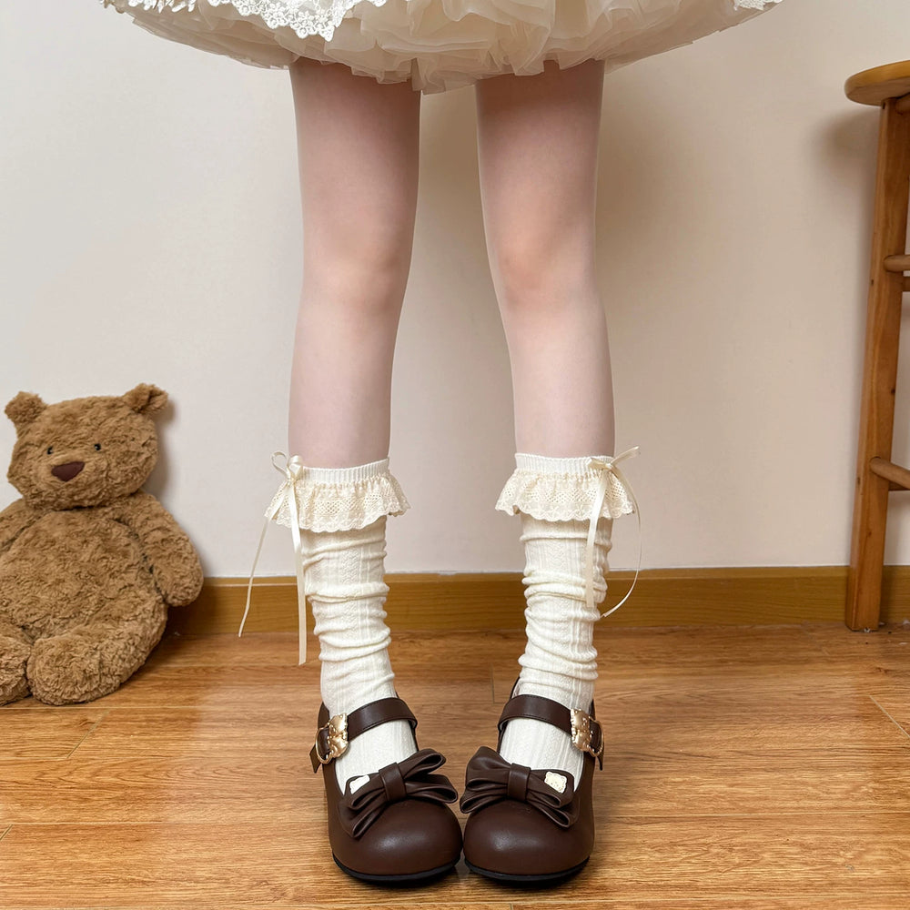 Modelled slouch calf socks in oatmeal and coffee brown with lace cuffs and bows