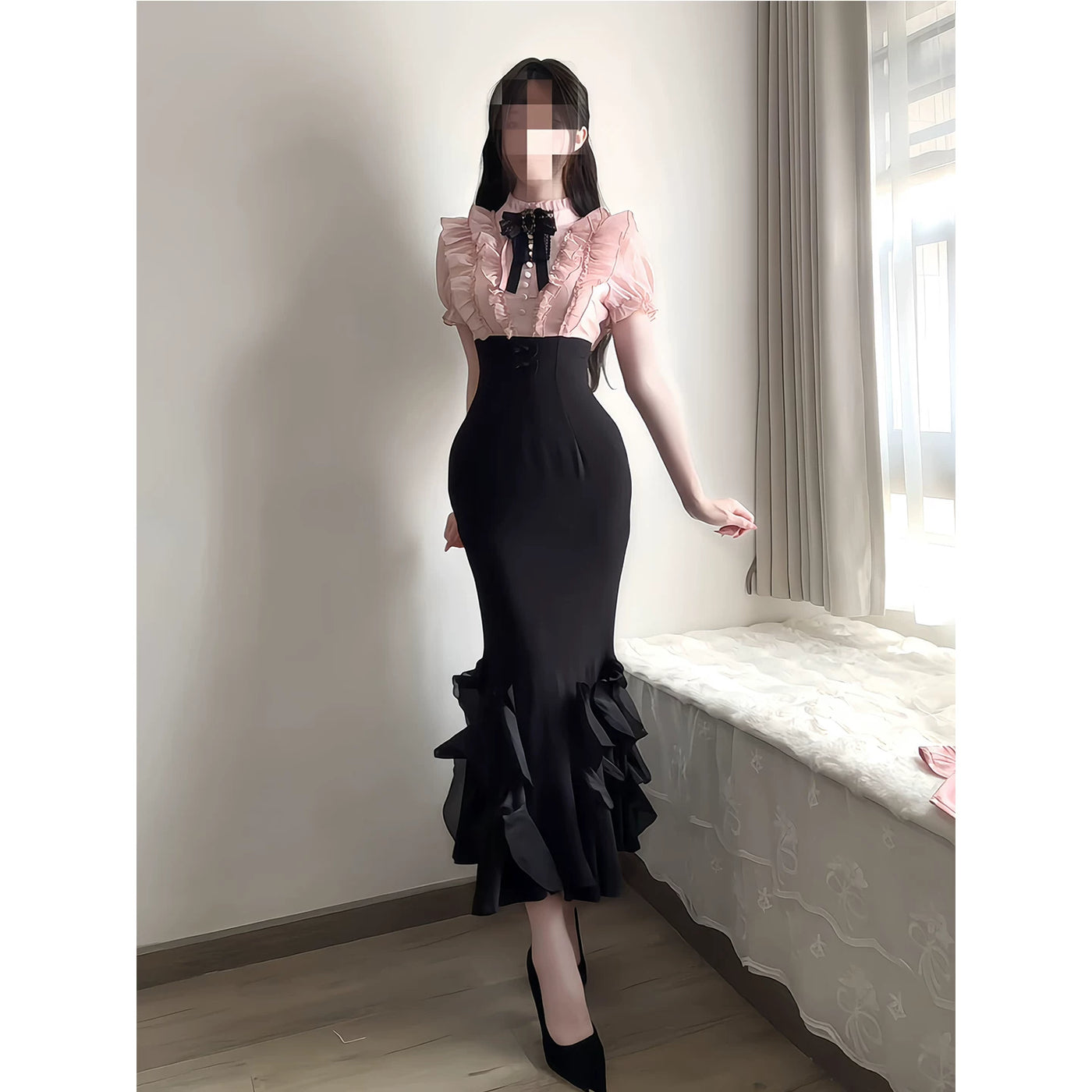 Black-pink OP dress with a ruffled pink bodice and layered mermaid hem worn by a model.