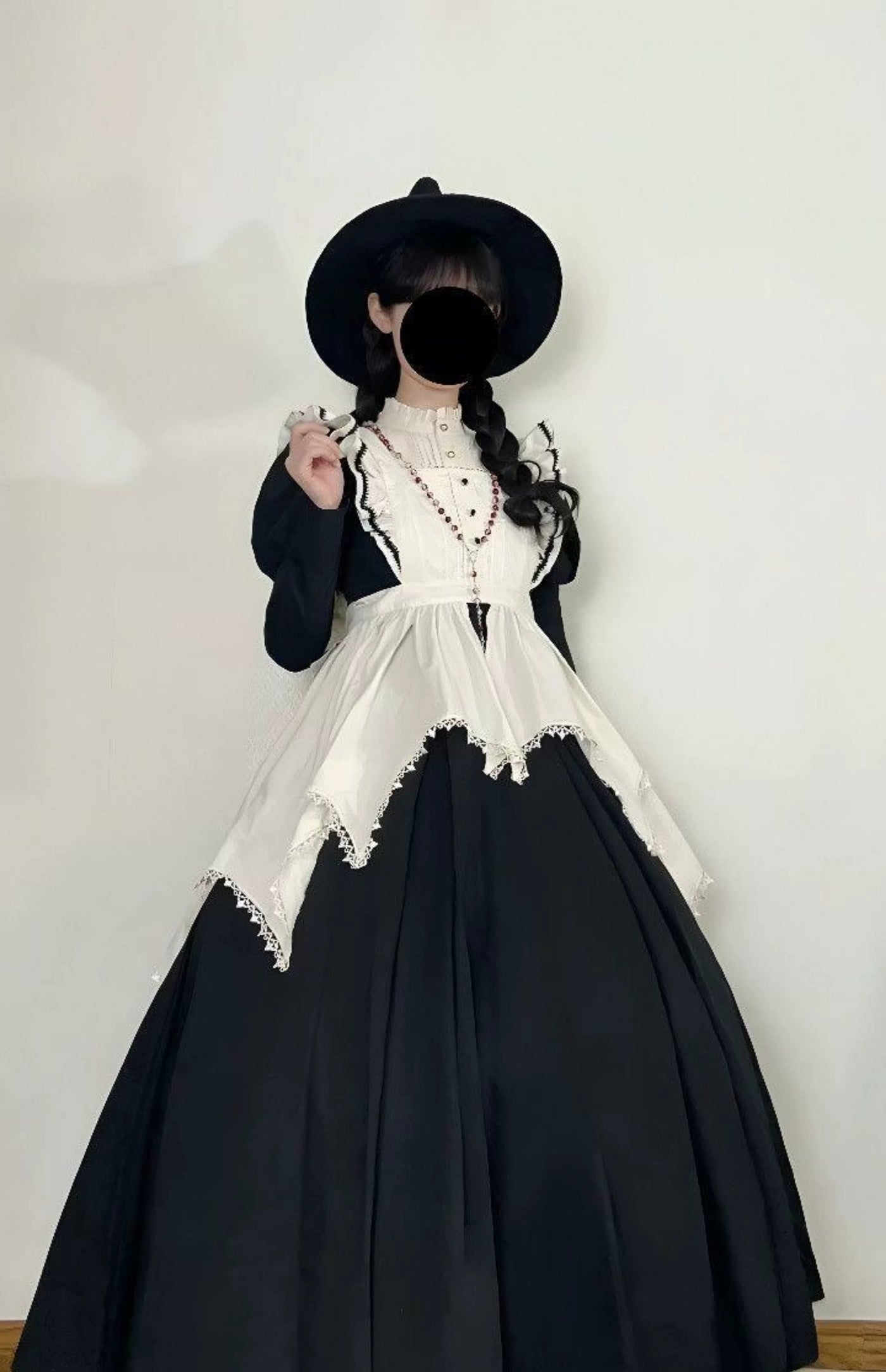 Sweetheart Dream Machine black OP dress with a white apron and puff sleeves.
