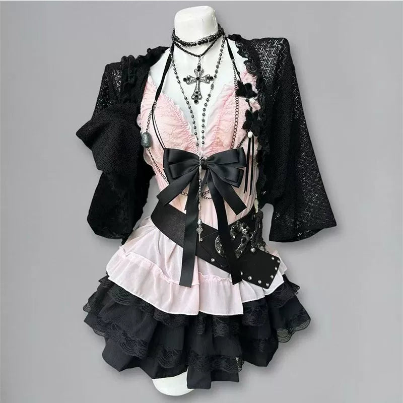 Black cardigan, pink vest and layered half-skirt three-piece set displayed on a mannequin