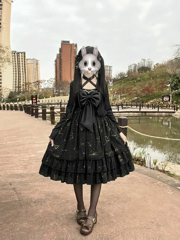 Creamy black OP dress set with large bow and gold print styled with a full tiered skirt.