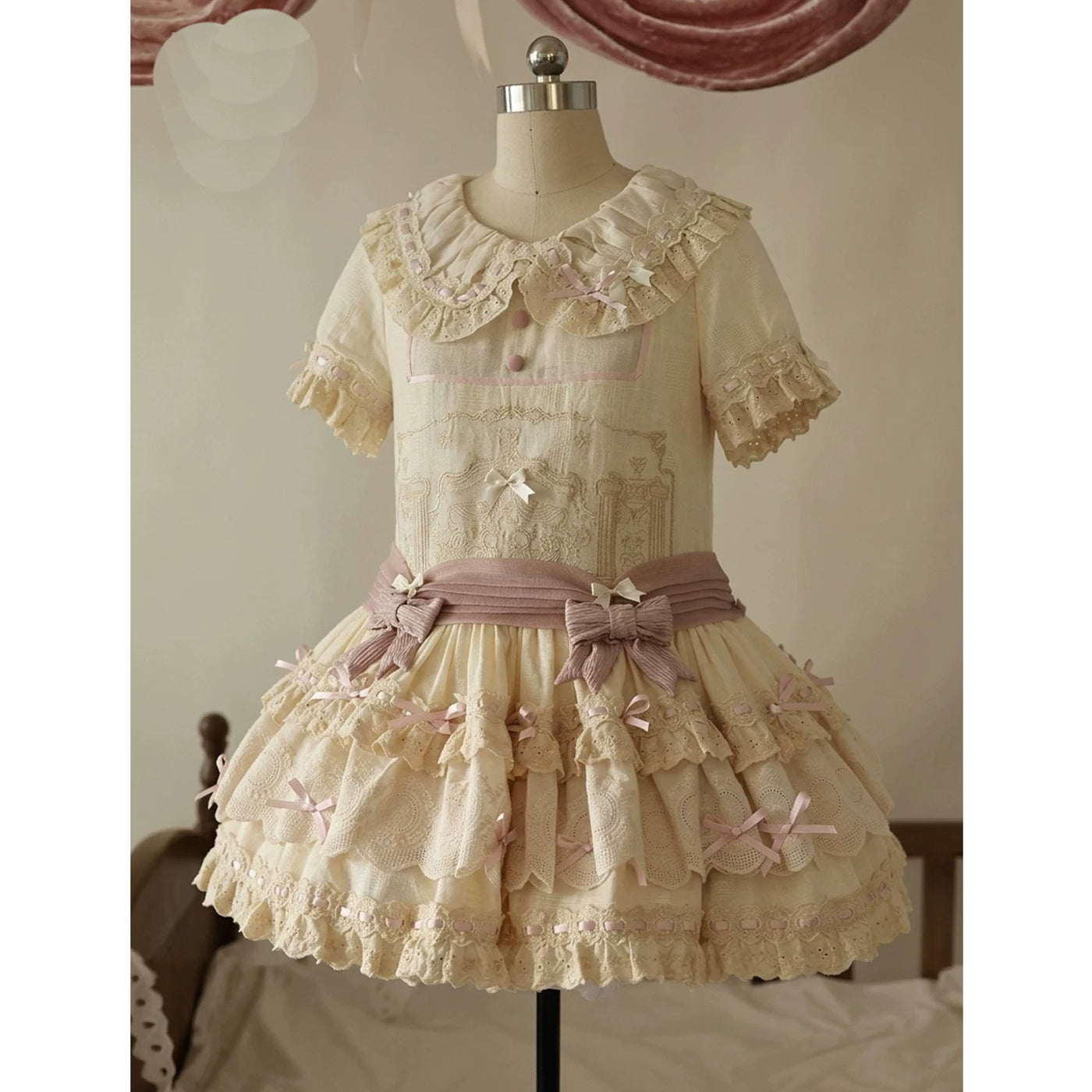 Pink-purple Lolita OP dress with mauve waist sash and puffed sleeves, detail view