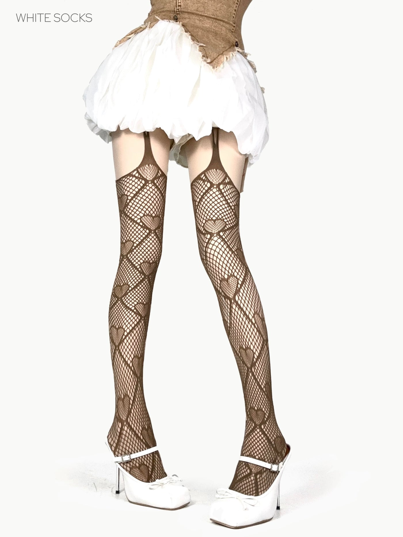 White and black heart-motif fishnet thigh-high stockings with suspender straps