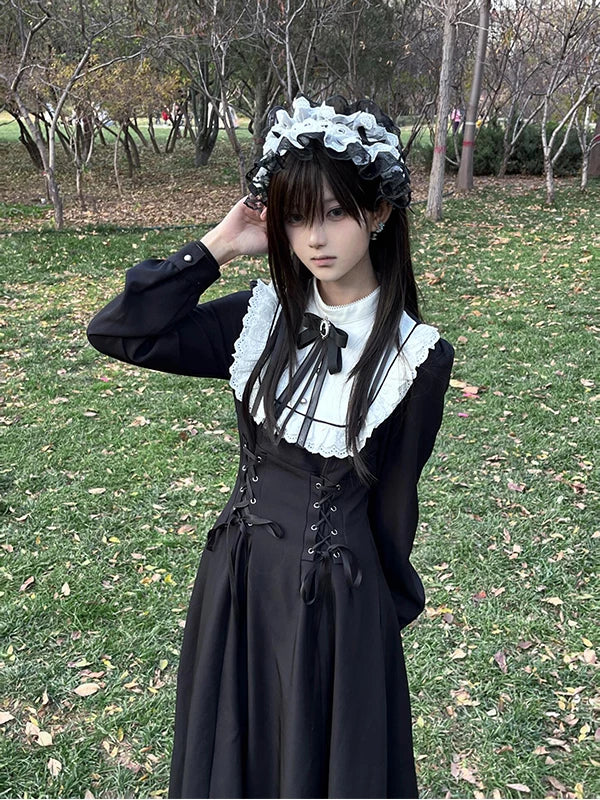 Creamy black one-piece dress with white ruffled collar and lace-up waist