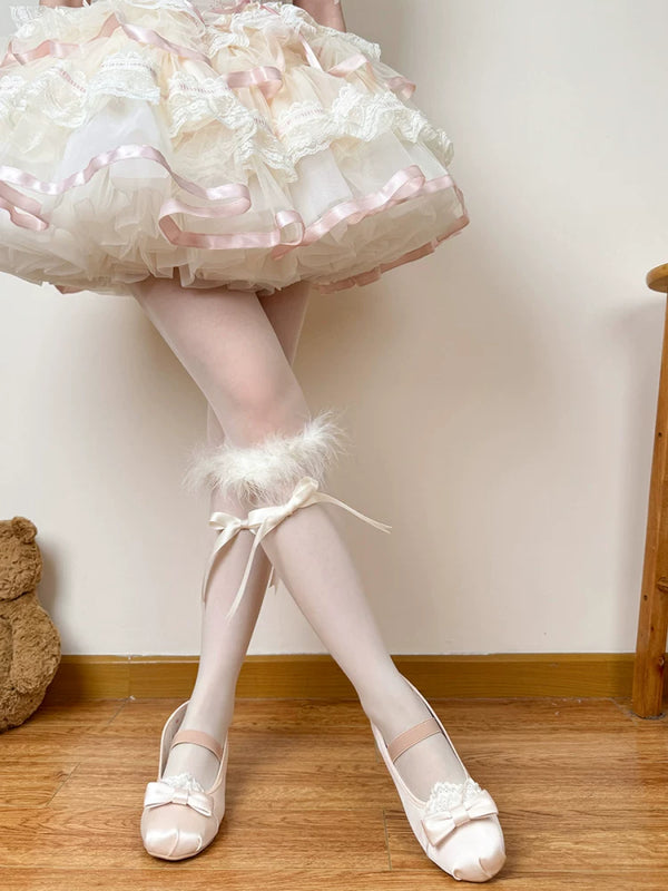 White ruffled calf slouch socks with feather trim and ribbon bows.