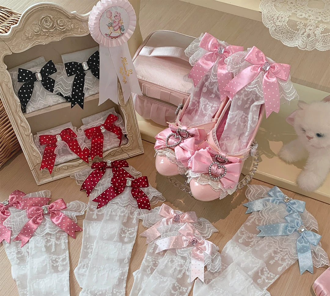 Lace socks with polka-dot bows and jewel-like centres arranged in pink, red, black, white and blue colourways.