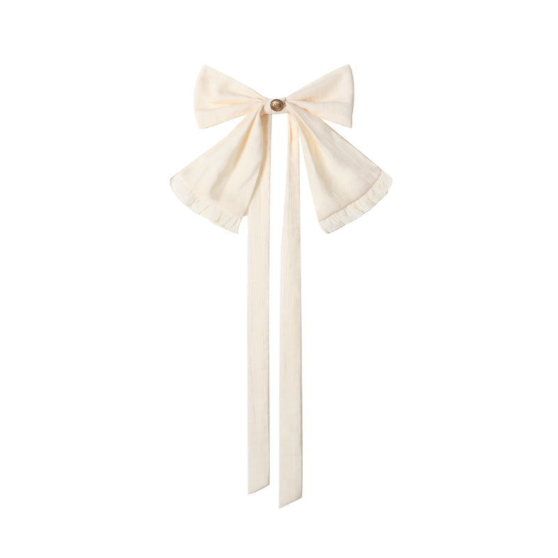 White bow tie and brown pointed false collar shown as separate accessories.
