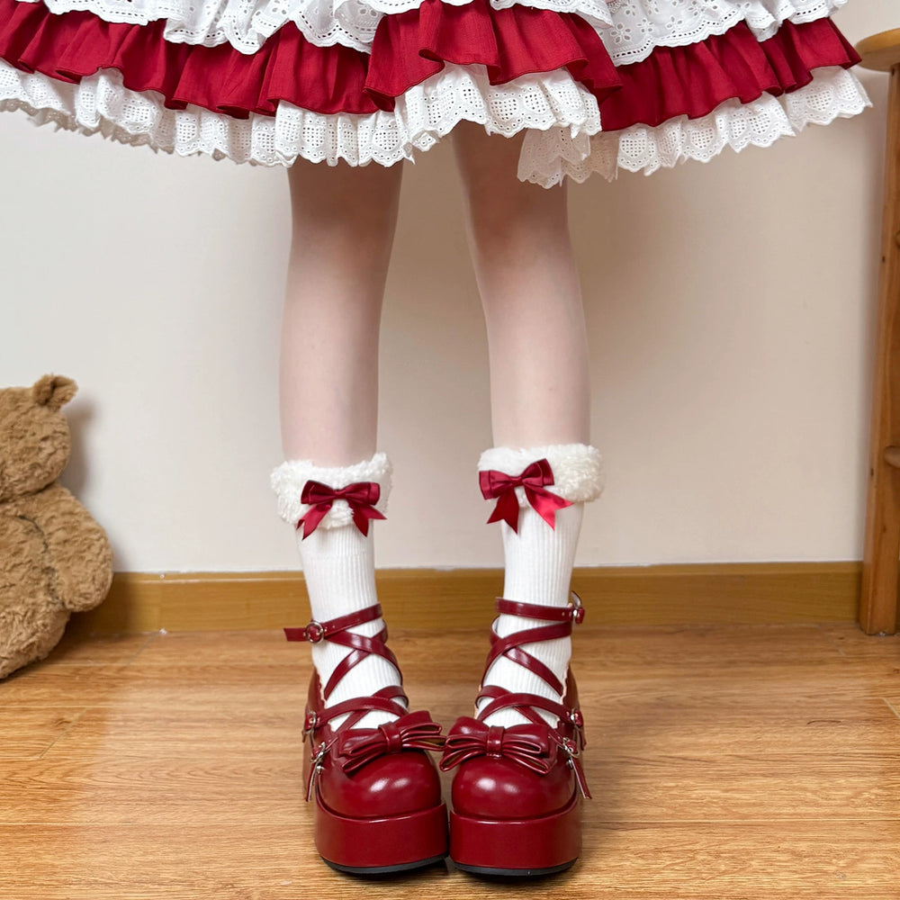 White mid-calf socks with gathered cuffs and burgundy bows styled with Lolita shoes