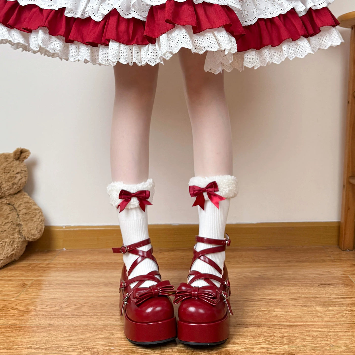 White mid-calf socks with gathered cuffs and burgundy bows styled with Lolita shoes