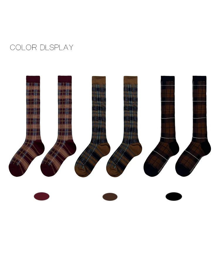 Plaid mid-calf socks with scrunched cuffs styled with chunky dark shoes.