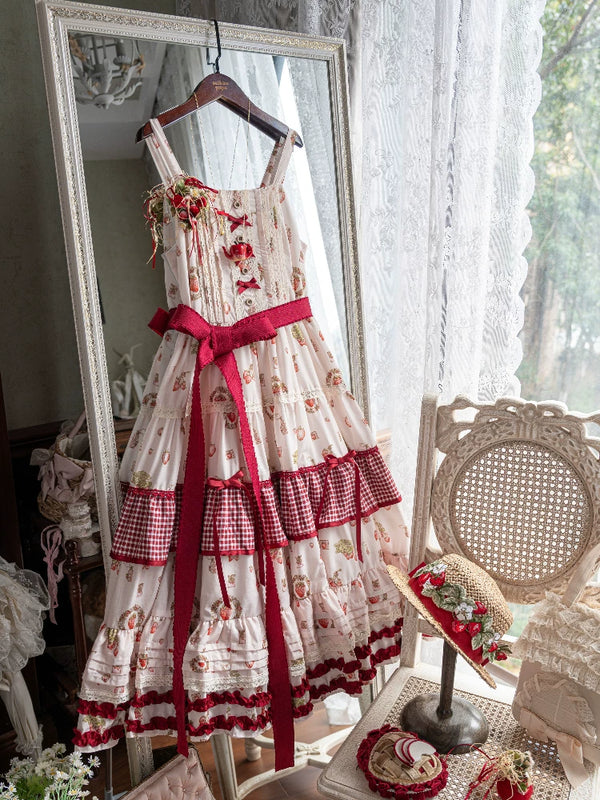 White Tea Story strawberry print tiered classical Lolita JSK displayed on wooden hanger