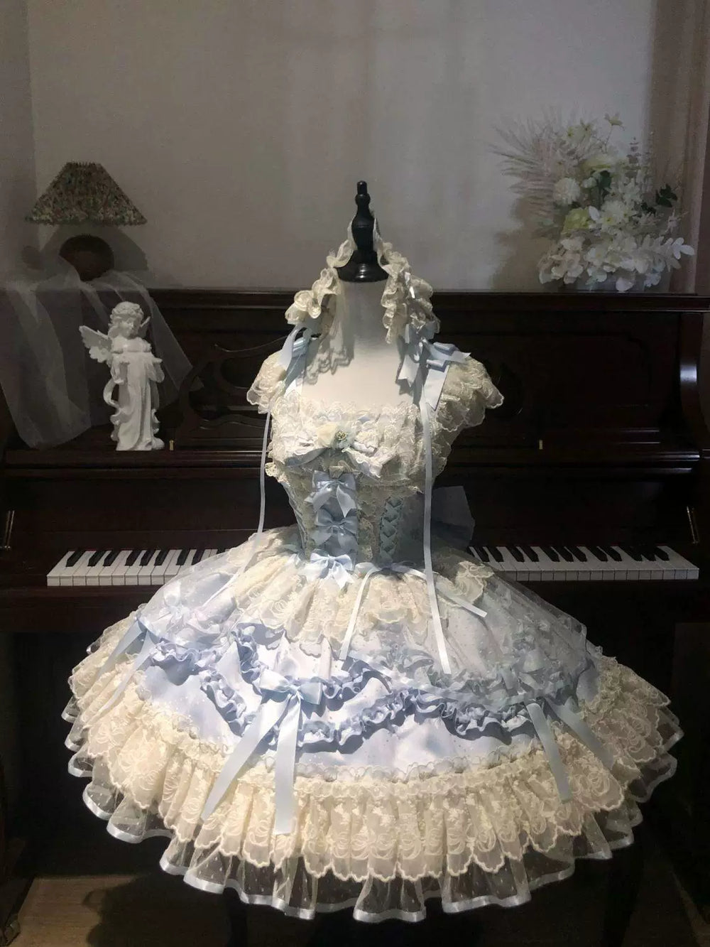 Light blue and pink Rose Poem Ballet JSK dresses with lace ruffles and ribbon bows.