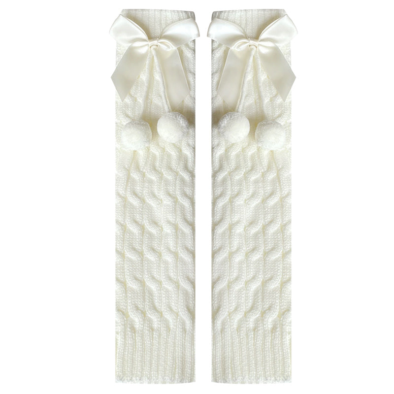 White knitted leg warmer pair with large bows and small pom-poms