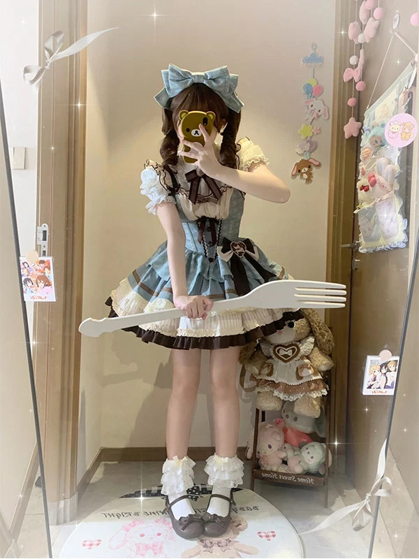 Mint-blue and chocolate-brown JSK dress set with a large head bow shown in a mirror