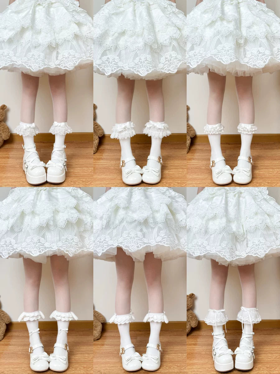 White Lolita sock collection with lace, bows and layered trims, shown in multiple variants.