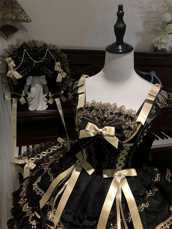 Black and gold JSK suspender dress with train displayed on mannequins