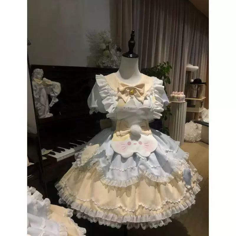 Sweetheart Dream Machine blue-and-yellow cat OP dress with apron on a mannequin