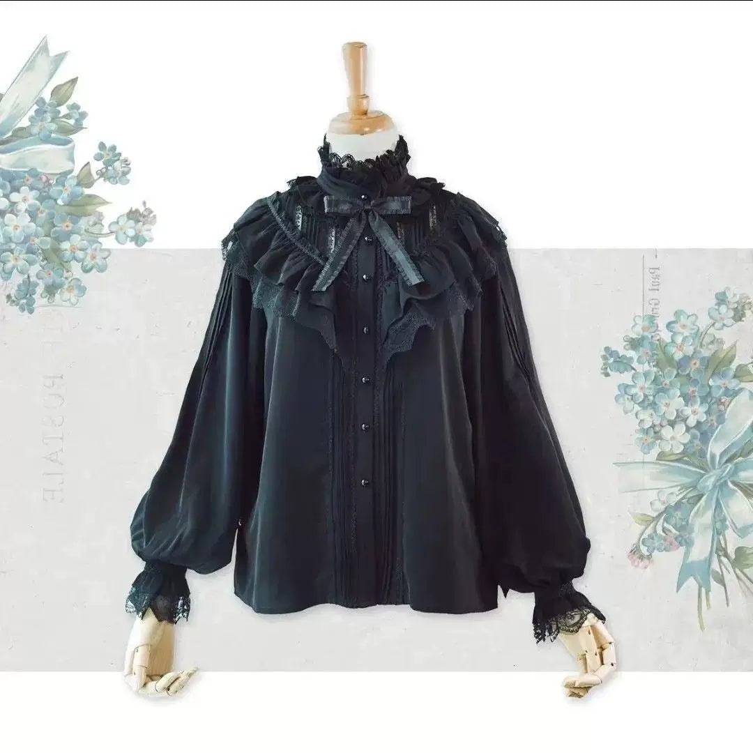 Cream high-neck chiffon blouse with lace ruffles and a ribbon bow shown on a mannequin.