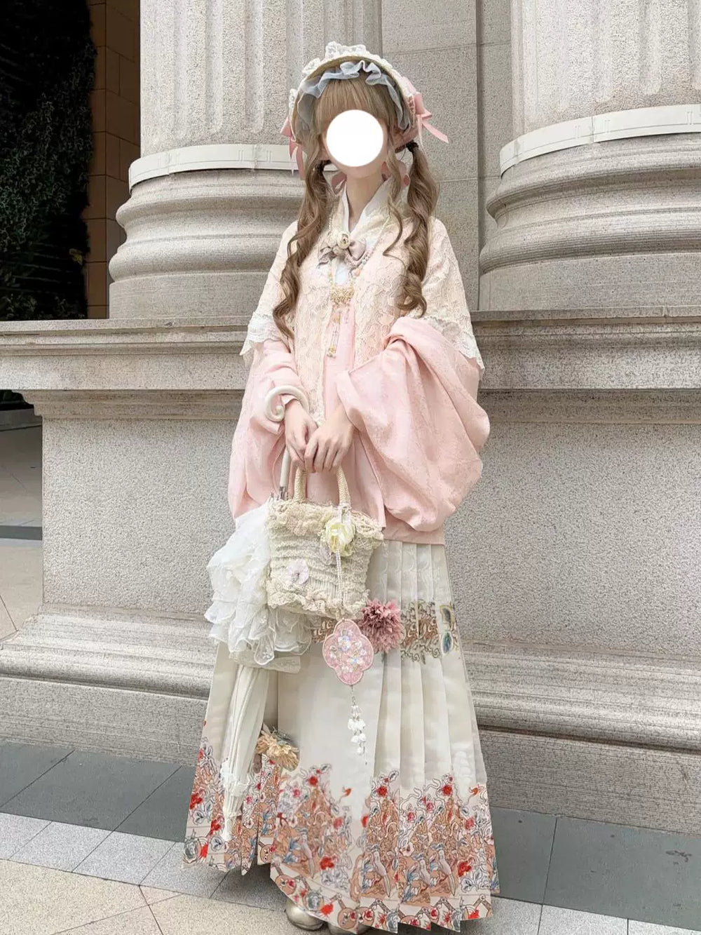 Pink Han-inspired Lolita outfit with shawl, printed mamian skirt and hat outdoors