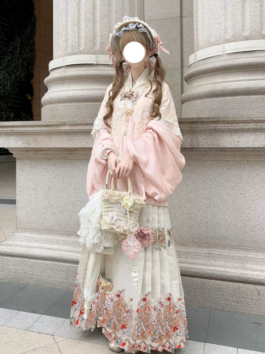 Pink Han-inspired Lolita outfit with shawl, printed mamian skirt and hat outdoors