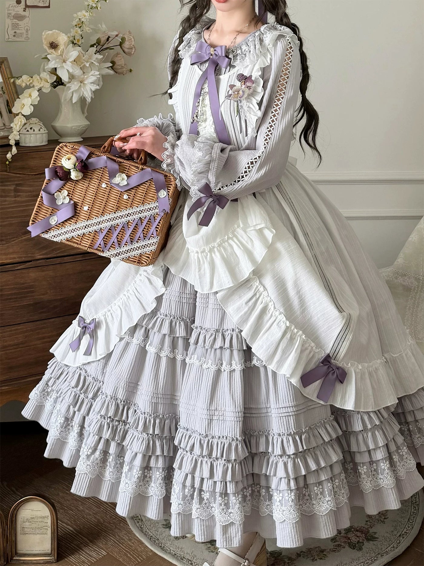 Full view of the dress's multi-tiered ruffled skirt with lace trim