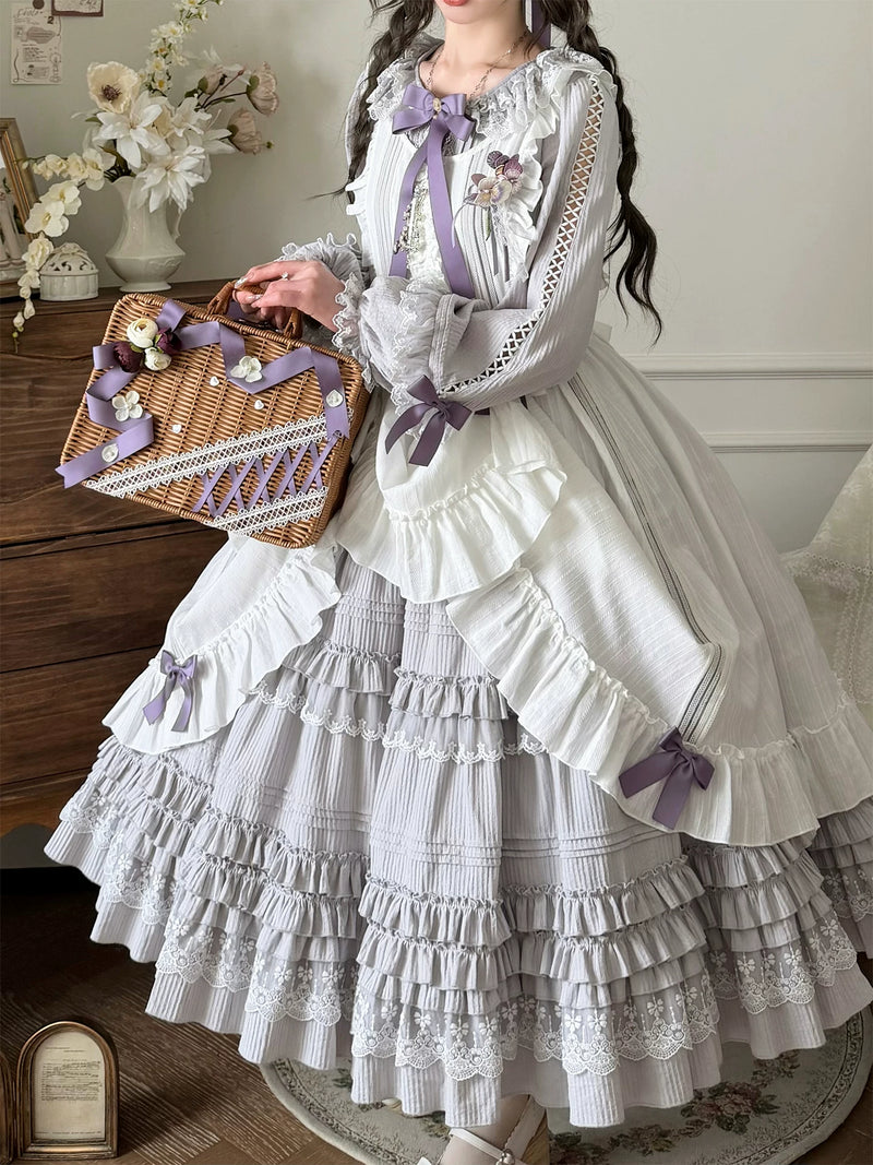 Full view of the dress's multi-tiered ruffled skirt with lace trim