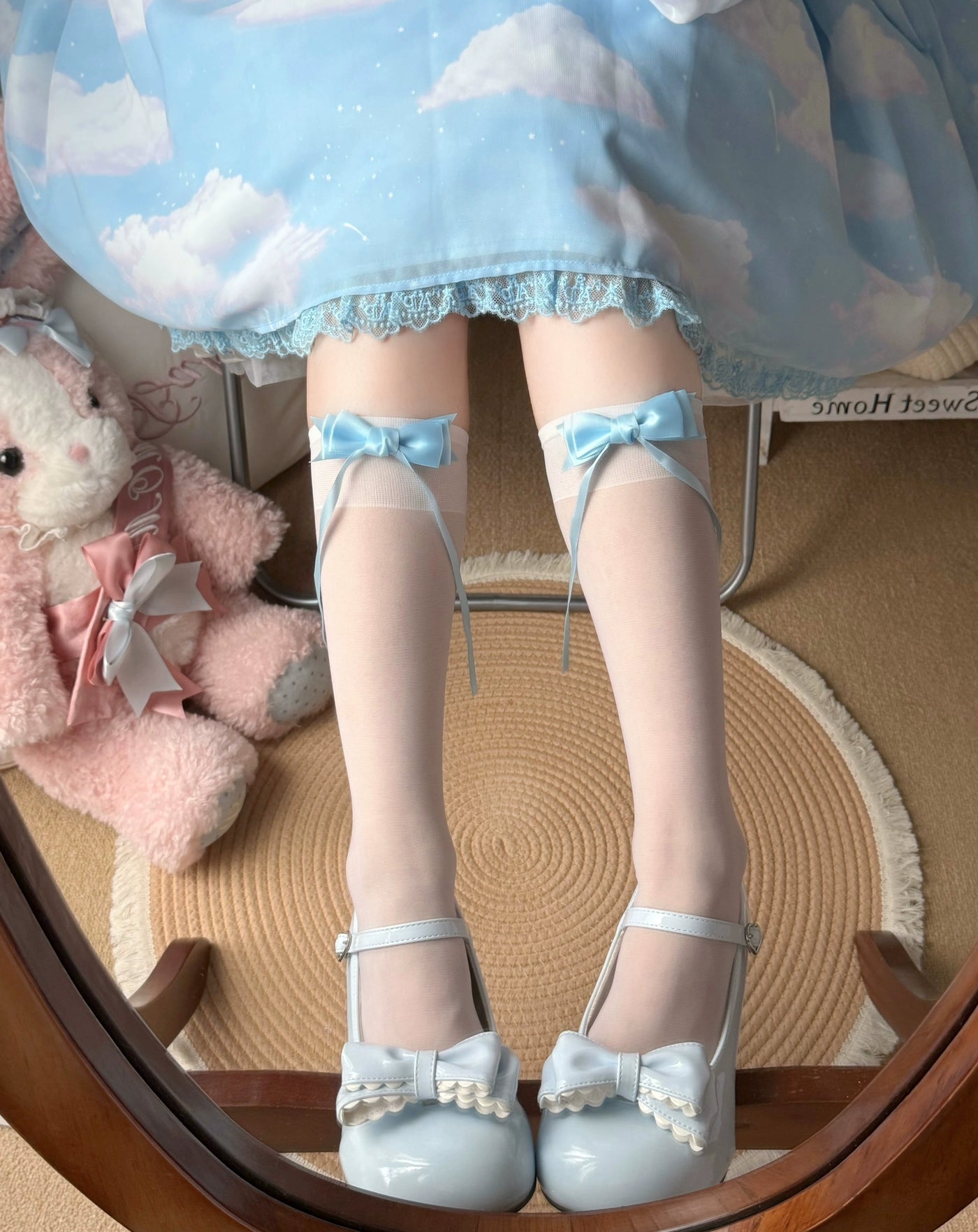 White bow-trimmed lace socks styled with black patent shoes