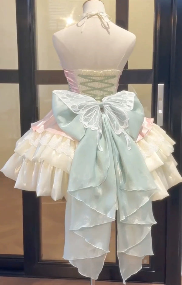 Powder green halter JSK with layered skirt and oversized back bow on a mannequin.