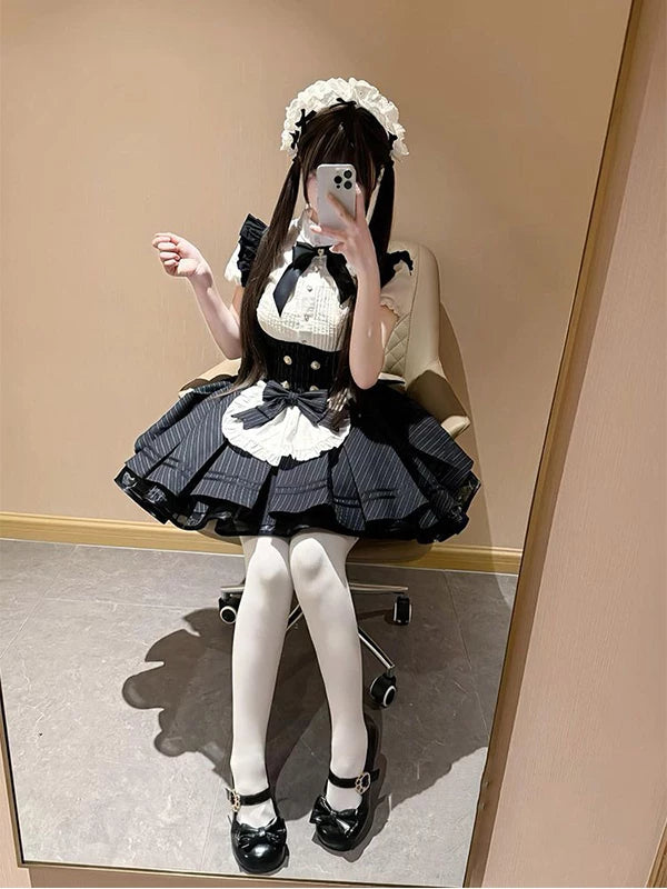 Model wearing a black and white striped short-sleeve maid-style OP dress set.