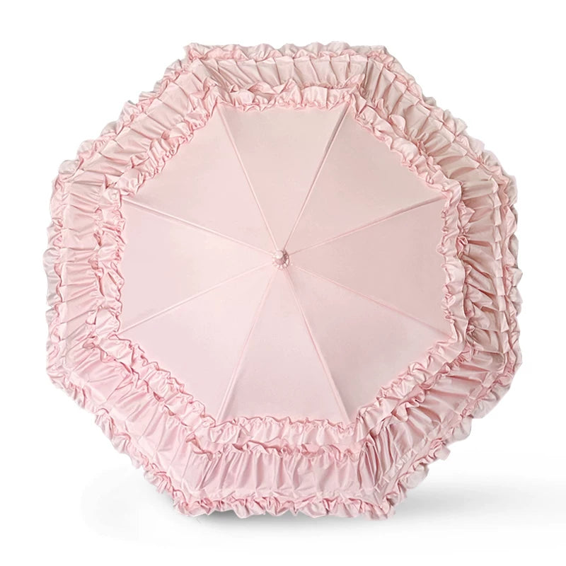 Pink layered ruffle Lolita umbrella with curved heart handle on a white background