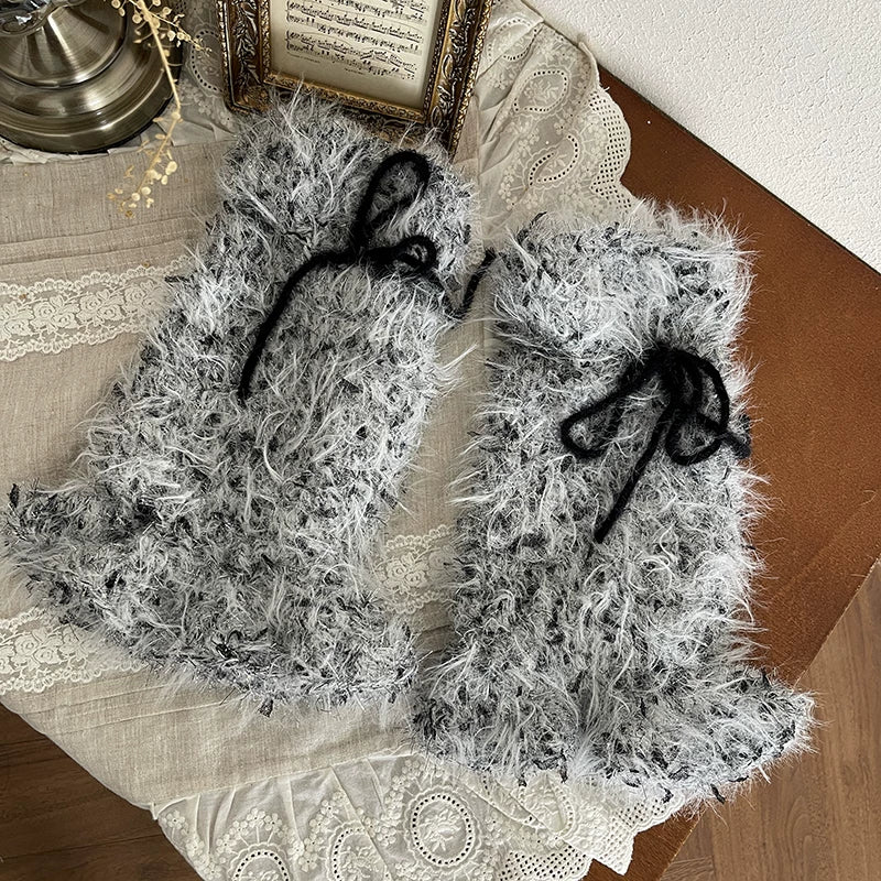 Black tights with gray fuzzy sequin sock covers and platform shoes.