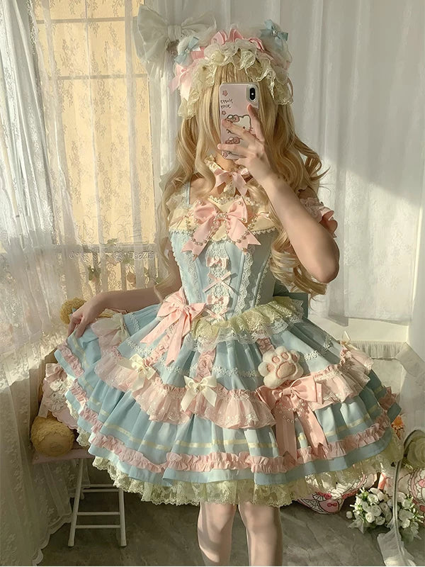 Blue-and-pink ruffled JSK dress with bows shown on a model.
