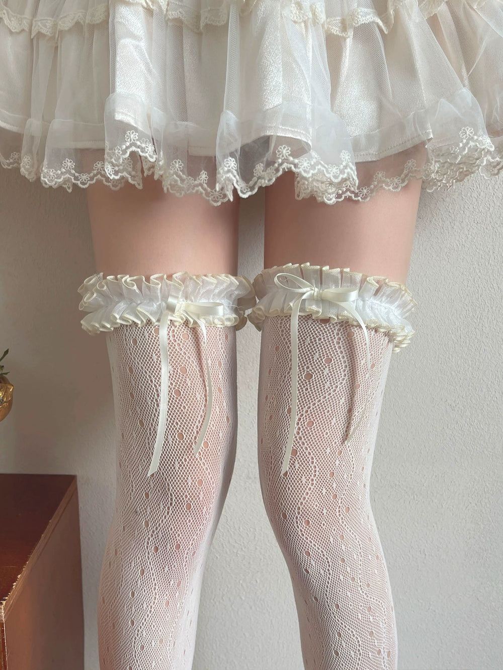 Black and white lace mesh over-the-knee socks with ruffled ribbon cuffs