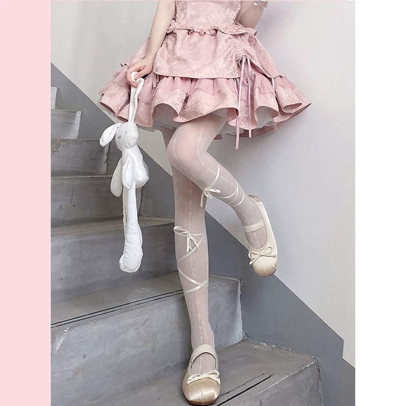 Black patterned tights with ribbon lacing and bow details