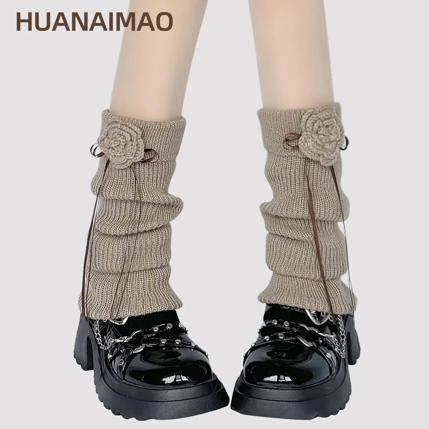 Milky white ribbed knit leg warmer with crochet floral appliqué and ribbon tie