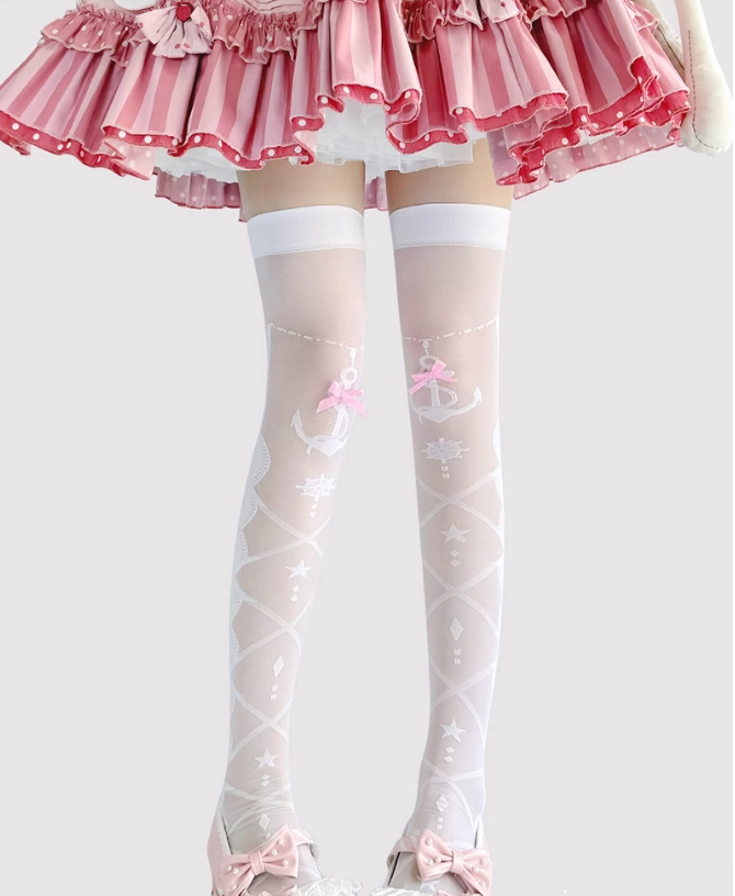 White sheer over-the-knee socks with star motifs and bows shown beneath a pink ruffled skirt.